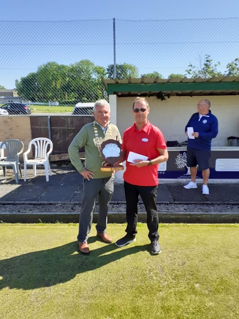 Paul Wilson receives his Prize and Trophy from President Mike Fleming
